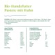 Biologische hondenvoer pâté met kip, met een lijst van ingrediënten en voedingsinformatie, inclusief 55% vlees, vitamines en mineralen.