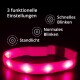 Ein pinker LED-Halsband für Haustiere auf dunklem Hintergrund mit drei Einstellungen: stetiges Licht, normales Blinken und schnelles Blinken.