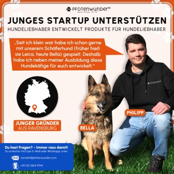 Gefalteter schwarzer Metall-Draht-Hundekäfig mit schwarzem Kunststofftablett und einem verpackten Gegenstand darin, auf grünem Gras platziert.