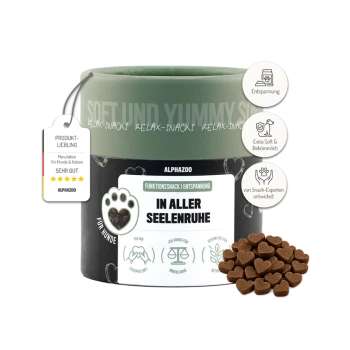 Ein Behälter mit AlphaZoo Entspannungssnacks für Hunde, beschriftet mit "IN ALLER SEELENRUHE", mit herzförmigen Leckereien daneben.