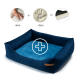 Marineblaues Haustierbett mit plüschigen Seiten und einem weichen Zentrum, mit einem Pluszeichen-Grafik und Handabdruck-Illustrationen, die Komfort anzeigen.