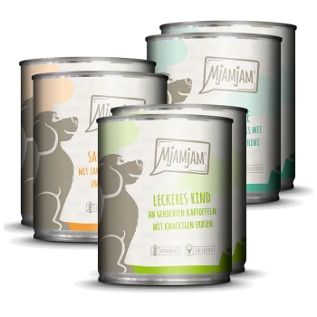 Vier Mjamjam-Hundfutterdosen mit Geschmacksrichtungen: "Leckeres Rind," "Sahne mit Zucchini," und "Rind mit Kartoffeln und Erbsen."
