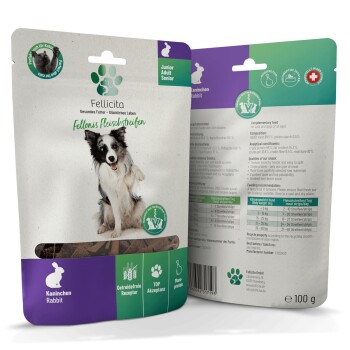 Zwei Fellicita 100 g Snacksbeutel mit Hundefoto, Pfotenlogo, sichtbarem Text 'Kaninchen (Rabbit)', 'Junior/Adult/Senior' und Produkticons