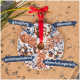 Ein kreisförmiger Vogelfutterornament mit einem roten Band, umgeben von Sonnenblumenkernen und deutschen Etiketten: "ganzjährig", "dekorativ", "proteinspeend."