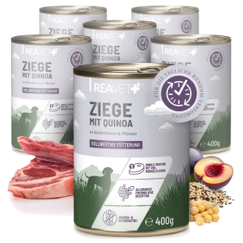 Dosen von REAVET+ Haustierfutter, beschriftet mit 'Ziege mit Hirse', das Ziegenfleisch mit Hirse, Kichererbsen und Pflaumen enthält, jeweils 400 g.