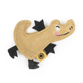 Ein niedliches, plüschiges Hundespielzeug in Form eines Alligators in Beige und Schwarz, mit gestickten Augen und einer rosa Wange, mit einem gelben Etikett.
