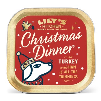 Lily's Kitchen Christmas Dinner dog food tray with turkey, ham, and trimmings, featuring a dog in a winter hat.