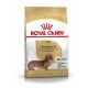 Torba z karmą dla psów Royal Canin Adult Dachshund, z długowłosym jamnikiem z przodu, z tekstem podkreślającym żywienie specyficzne dla rasy.