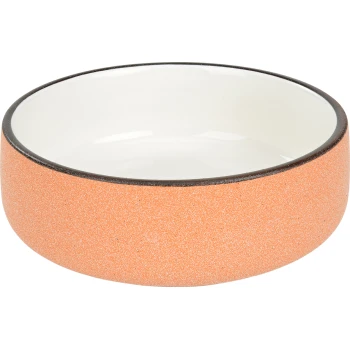 Keramischer Futternapf für Haustiere mit einer strukturierten orangen Außenseite und einer glatten weißen Innenseite, mit einem dunklen Rand.