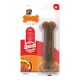 Braunes, knochenförmiges Nylabone-Kauspielzeug in der Verpackung, beschriftet mit "Bacon"-Geschmack, mit den Highlights "Extra langlebig" und "Extremes Kauen."