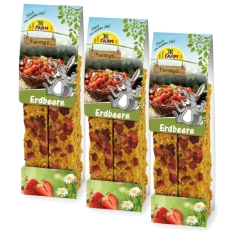 Trzy opakowania przekąsek truskawkowych JR FARM Farmys dla zwierząt, z rysunkowym królikiem i koszem truskawek na etykiecie.