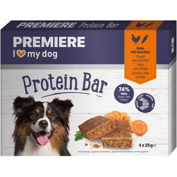 Premiere I love my dog Protein Bar packaging featuring a happy dog, with bars and carrots, highlighting 74% chicken content.