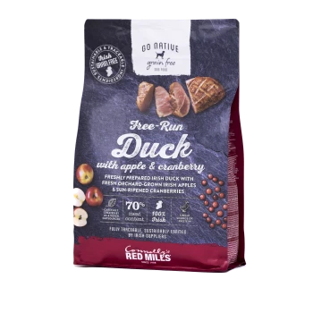 A bag of Go Native grain-free dog food featuring Free-Run Duck with apple and cranberry, highlighting 70% meat content and 100% Irish ingredients.