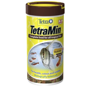 TetraMin fish food container with a yellow label stating "Complete food for all tropical fish" and "BioActive + Prebiotic" for health.
