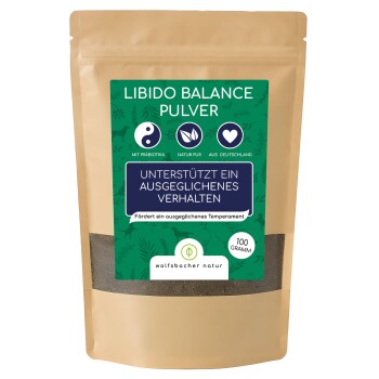 Ein braunes Päckchen mit der Aufschrift 'Libido Balance Pulver' mit grünen und blauen Akzenten, das 'Unterstützt ein ausgewogenes Verhalten' für Hunde angibt, 100 Gramm.