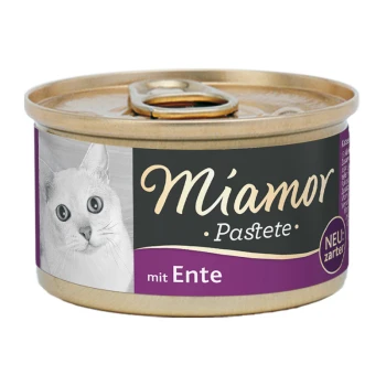 Boîte de nourriture pour chats avec un chat blanc sur l'étiquette, étiquetée 'Miamor Pastete mit Ente' avec 'NEU: zarter' indiquant une nouvelle texture plus douce.