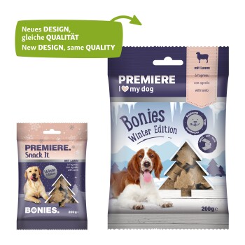Two pet treat packages: left "Premiere Snack It" with winter design, right "Premiere I ♥ my dog Bonies" with snowy mountain and dog.