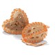 Two pet chew toys shaped like a heart and an oval, made of a light-colored material with orange accents and holes for texture.