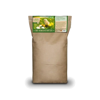 Sac en papier brun de nourriture pour poussins bio, étiqueté "BIO-KÜKENSTARTER," avec un poussin et des pissenlits sur le devant.