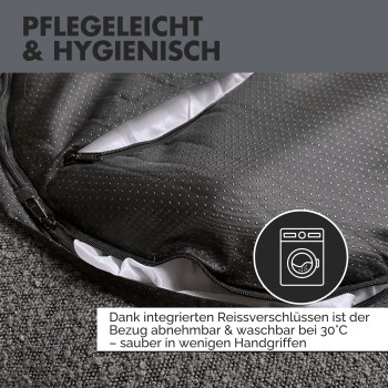 Grauem Haustierbett mit einem gepolsterten Design, das ein Etikett mit der Aufschrift "PAW WOW" und den Text "Abziehbar & waschbar" (abnehmbar & waschbar) zeigt.
