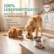 Für ein gesundes Tier, LFGB geprüfte Materialien, hergestellt in Deutschland. Eine Person hält einen weißen Teller, während ein Hund danach greift.