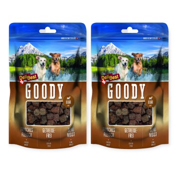 Deux sacs de friandises pour chiens DeliBest Goody avec un arrière-plan de montagne, étiquetés "Viande fraîche", "Sans céréales", "Semi-humide" et "Chèvre".