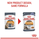 Comparison of two Royal Canin cat food pouches: "Intense Beauty" left, "Hair & Skin" right, noting "New design, same formula."