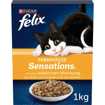 Une boîte de 1 kg de nourriture pour chats Purina Felix Farmhouse Sensations, présentant un chat noir et blanc joueur et un mélange de poulet, dinde et légumes.