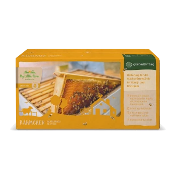 Box mit 'Mein kleiner Bauernhof' Bienenstockrahmen, mit einer Wabe mit Bienen, und Text, der Verwendung und Materialien auf Deutsch beschreibt.