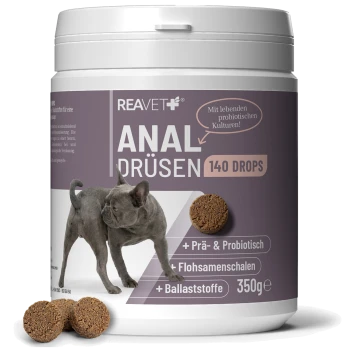 Weißer Behälter mit der Aufschrift 'REAVET ANAL DRÜSEN 140 DROPS' zeigt eine Französische Bulldogge, Futterpellets und '350g'.