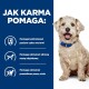 Pies siedzi na niebieskim tle z tekstem o korzyściach z karmy dla psów: kontroluje poziom cukru we krwi, utrzymuje masę mięśniową i wspiera wagę.