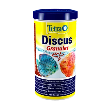 Tetra Discus Granules container with colorful discus fish illustrations and text on complete nutrition for health and growth.