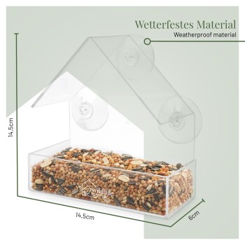 Klarer Kunststoff-Fenstersaugnapf-Vogelfutterspender, mit Samen gefüllt, beschriftet mit wildlife home und Weatherproof material.