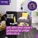 Gemütliches Wohnzimmer mit einem grauen Sofa, gelbem Kissen, schlafender Katze, Reiseutensilien und einer Katze, die aus einer gelben Tasche schaut. Text: "WEIL DEINE KATZE URLAUBE & WOCHENENDTRIPS WENIGER SCHÄTZT ALS DU."
