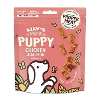 Lily's Kitchen Puppy Chicken & Salmon Nibbles training treats packaging, featuring a playful dog illustration and text highlighting "Proper Meat."