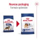 Image de deux sacs de nourriture pour chiens Royal Canin étiquetés "MAXI Adult" et "L maxi adult," avec une flèche rouge pointant vers un nouvel emballage.