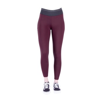 Bordeauxfarbene Leggings mit hohem Bund und Netzdetails, kombiniert mit schwarzen Turnschuhen.