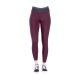 Bordeauxfarbene Leggings mit hohem Bund und Netzdetails, kombiniert mit schwarzen Turnschuhen.