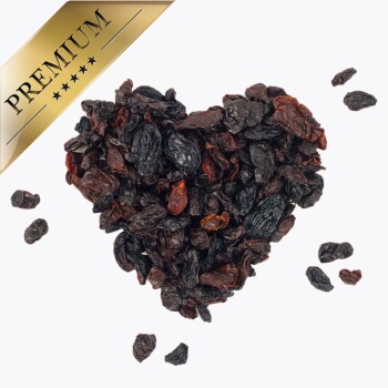 Getrocknete Früchte, die in Herzform angeordnet sind, mit einem goldenen Etikett "PREMIUM" in der Ecke.