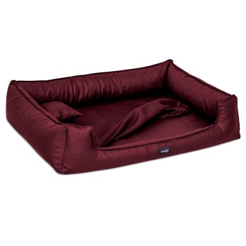 Burgunderfarbenes Haustierbett mit erhöhten Rändern und einem weichen Innenraum, mit einem kleinen Etikett mit dem Markennamen 'thedog', das an der Seite sichtbar ist.