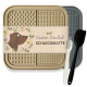 Dieter Dackel Schleckmatte Futtermatte in Beige und Grau, mit einer Hundillustration und zwei Utensilien: einer weißen Bürste und einem schwarzen Spatel.
