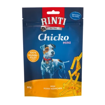 Rinti Chicko Mini Hundesnacks-Paket mit blauem Hintergrund, einer Hundillustration und Text, der "100% Huhn-Filet" und "Mini Huhn-Häppchen" angibt.