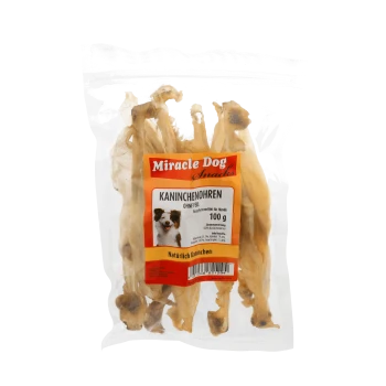 Packung Miracle Dog Snacks Kaninchenohren Hundeleckerlis, 100g, mit Hundebild auf dem Etikett.