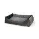 Gray pet bed with a soft, plush surface and raised edges for comfort, featuring a small leather tag on the side.