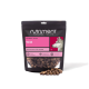 Tüte Nutriment Natural Treats Wild Gourmet-Slices 1 kg mit rosa Etikett, Husky-Motiv und verschütteten mundgerechten Leckerli.
