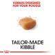 Kibble designed specifically for poodles, featuring a brown, square-shaped piece of kibble with a sketch outline, labeled "Tailor-Made Kibble."