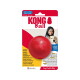 Czerwona piłka KONG na opakowaniu z zdjęciem dziewczynki i psa; widoczne napisy: „KONG Ball”, „Durable Natural Rubber”, „Extreme Bounce”