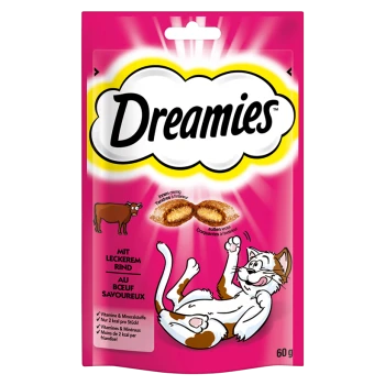 Pink packaging of Dreamies cat treats featuring a playful cat and a cow, with text highlighting beef flavor and nutritional benefits.