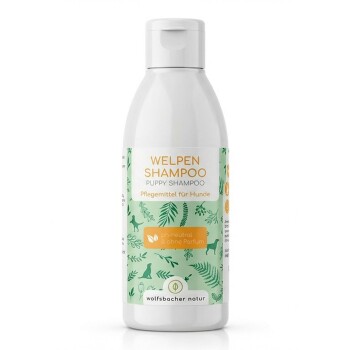 Flasche "Welpen Shampoo" für Hunde, mit einem grünen Etikett mit Hund- und Blattillustrationen, pH-neutral und duftfrei.