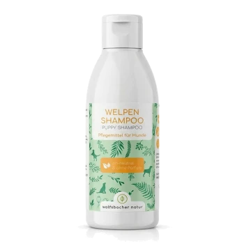 Flasche "Welpen Shampoo" für Hunde, mit einem grünen Etikett mit Hund- und Blattillustrationen, pH-neutral und duftfrei.